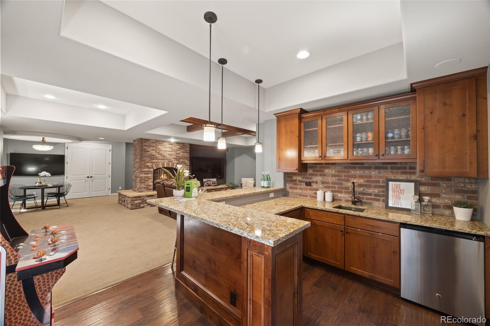 10466 Marigold Court Highlands Ranch, CO 80126 - Photo 33 of 50 a kitchen with sink stove and cabinets