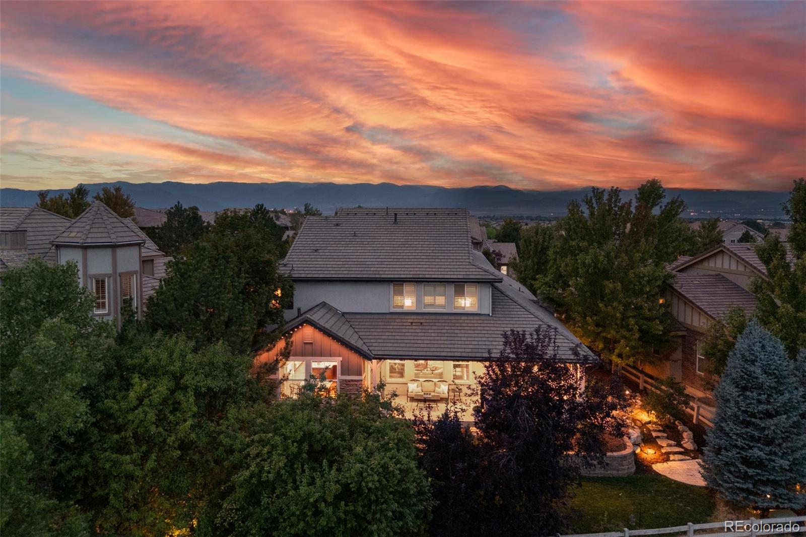 10466 Marigold Court Highlands Ranch, CO 80126 - Photo 39 of 50 a aerial view of a house with a yard and mountain view in back