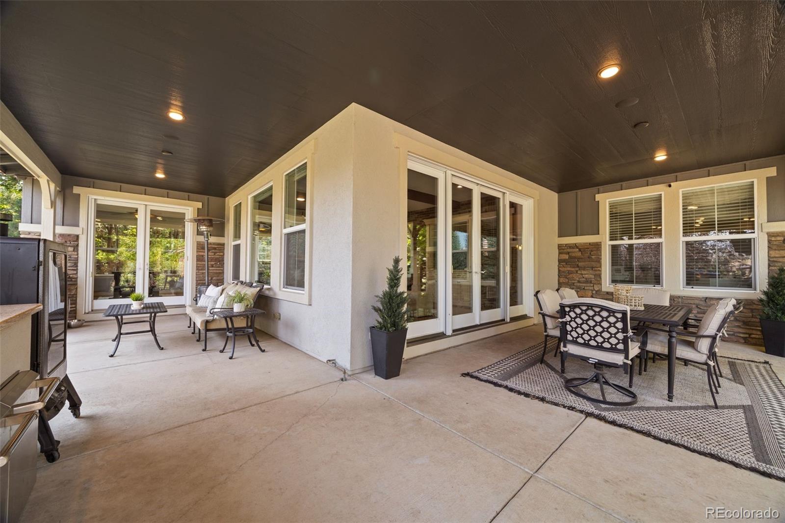 10466 Marigold Court Highlands Ranch, CO 80126 - Photo 41 of 50 a balcony with chairs and glass door