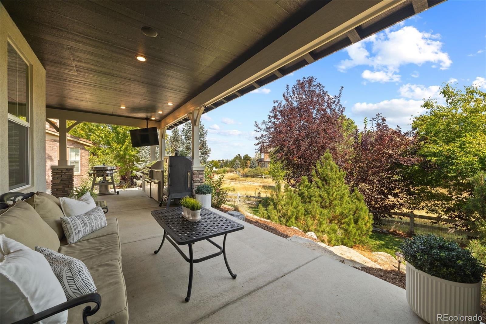 10466 Marigold Court Highlands Ranch, CO 80126 - Photo 42 of 50 a outdoor living space with furniture and city view