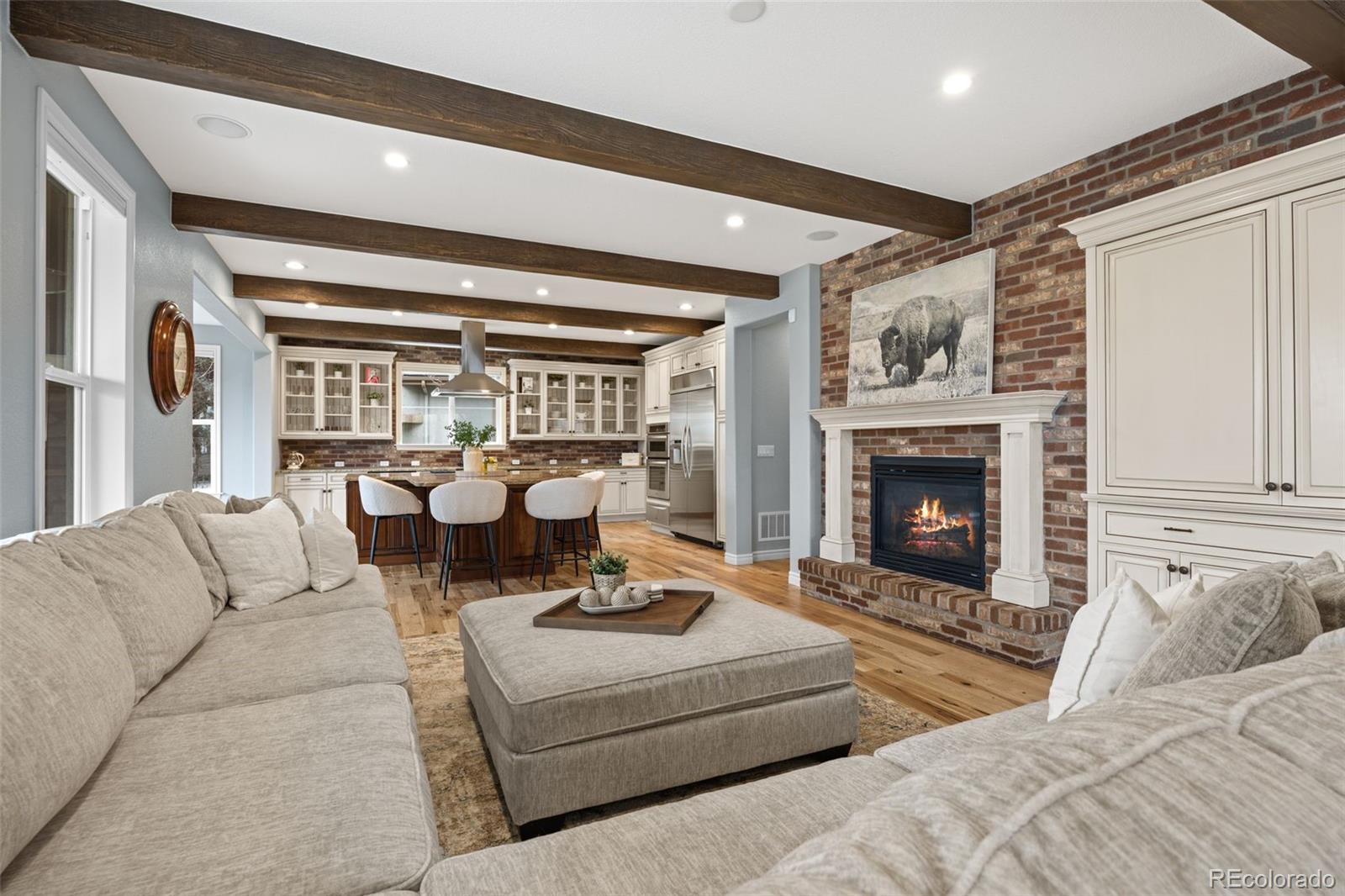 10466 Marigold Court Highlands Ranch, CO 80126 - Photo 5 of 50 a living room with furniture fireplace and a large window