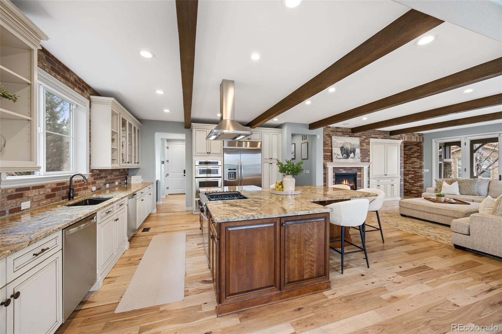 10466 Marigold Court Highlands Ranch, CO 80126 - Photo 8 of 50 a large kitchen with a table and chairs