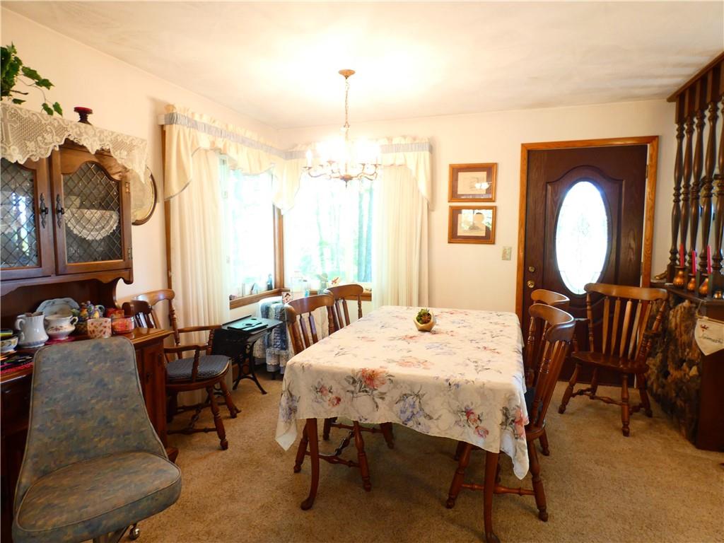 2223 Sandy Lake-Grove City Road Jackson Center, PA 16133 - Photo 12 of 30 a view of a dining room with furniture window and wooden floor