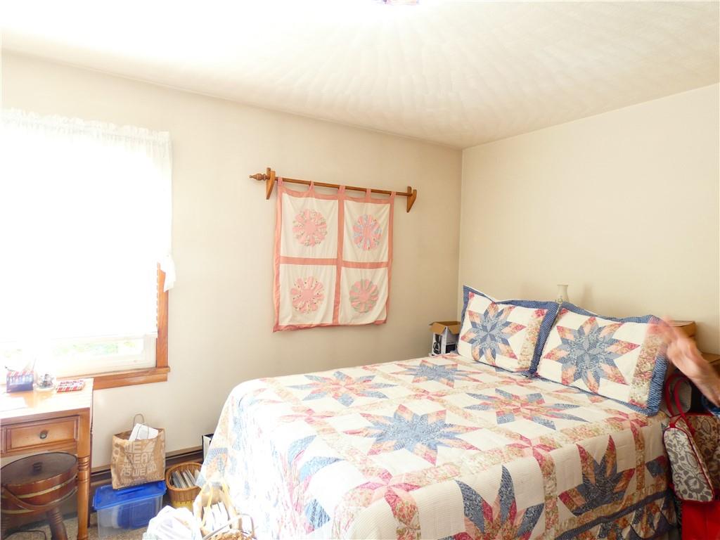 2223 Sandy Lake-Grove City Road Jackson Center, PA 16133 - Photo 18 of 30 a bedroom with a bed and a window