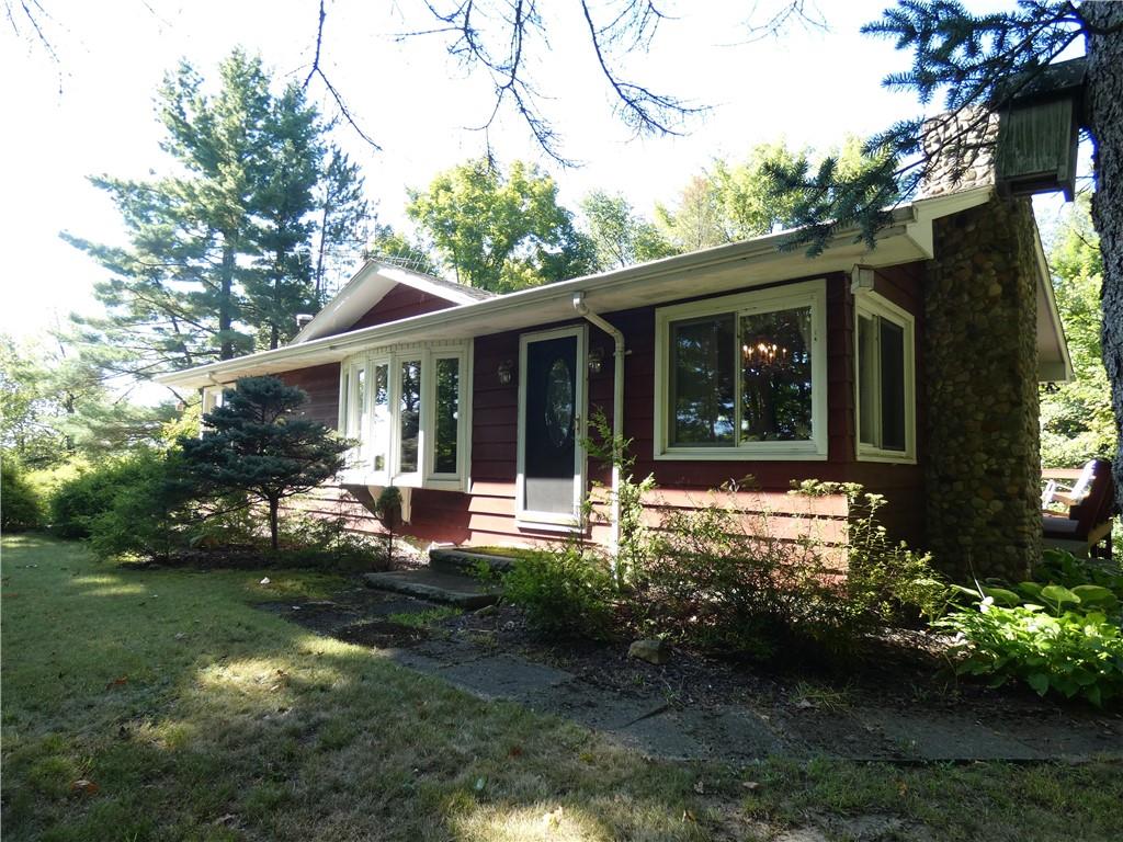 2223 Sandy Lake-Grove City Road Jackson Center, PA 16133 - Photo 2 of 30 a view of a house with backyard sitting area and garden