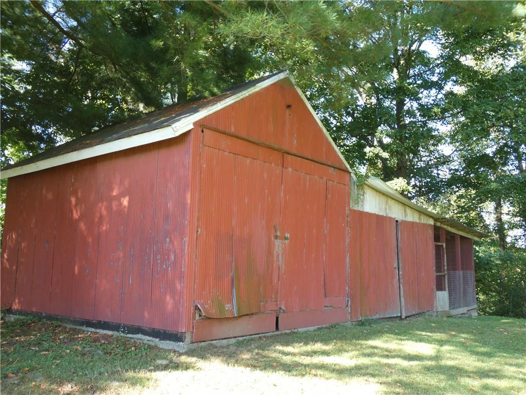 2223 Sandy Lake-Grove City Road Jackson Center, PA 16133 - Photo 26 of 30 a backyard view with hardwood wall