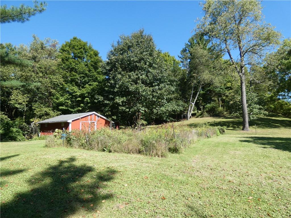 2223 Sandy Lake-Grove City Road Jackson Center, PA 16133 - Photo 27 of 30 a backyard of a house with lots of green space