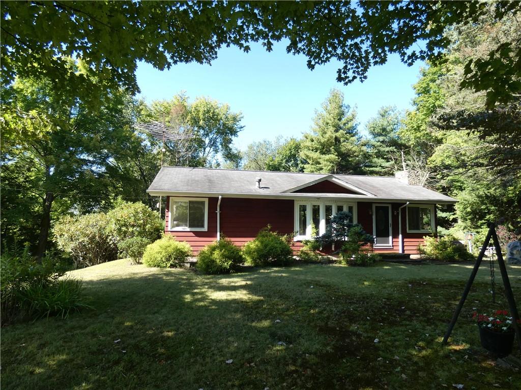 2223 Sandy Lake-Grove City Road Jackson Center, PA 16133 - Photo 3 of 30 a front view of a house with garden