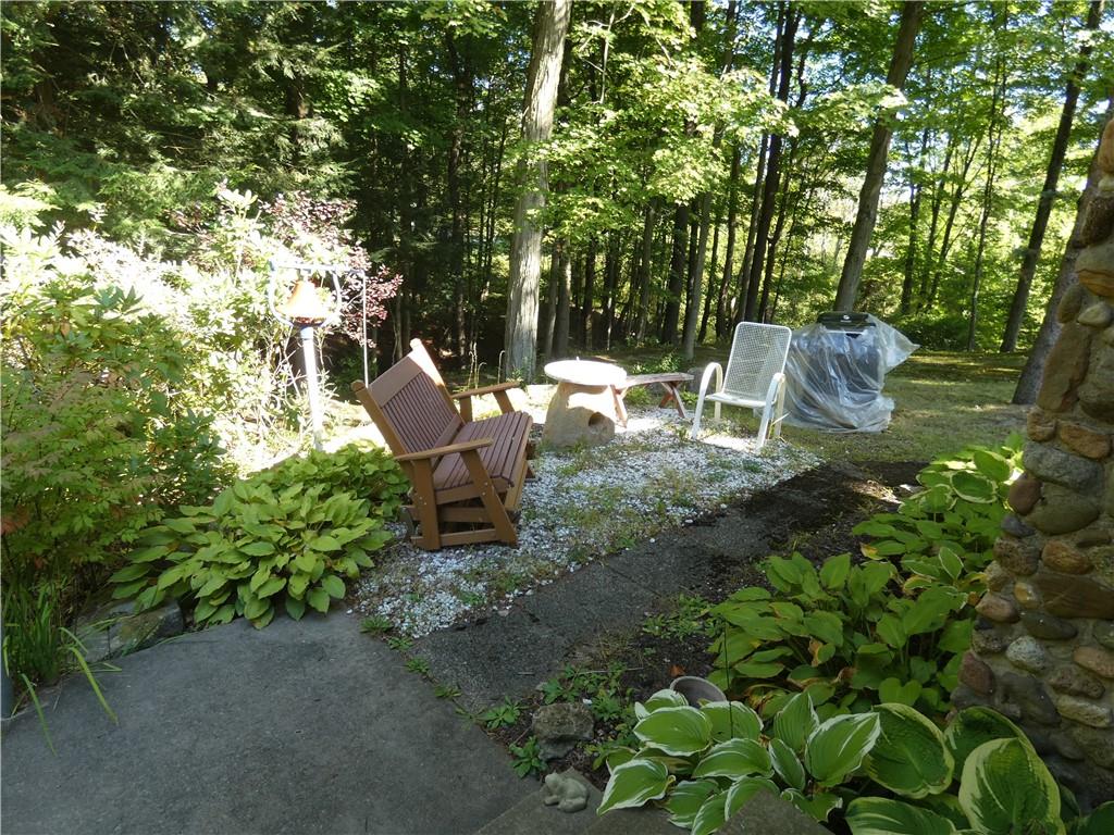 2223 Sandy Lake-Grove City Road Jackson Center, PA 16133 - Photo 4 of 30 a backyard of a house with table and chairs