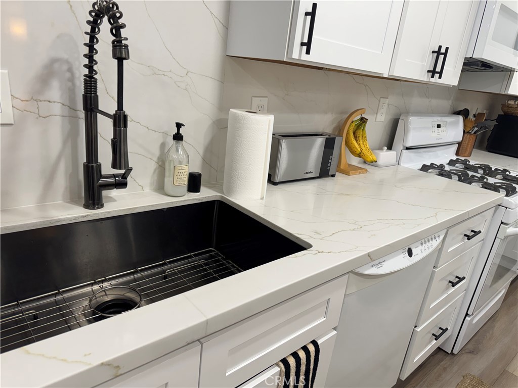 682 East Workman Street Covina, CA 91723 - Photo 11 of 36 a close view of appliances and cabinets