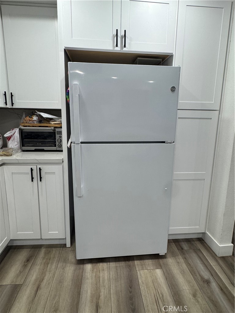 682 East Workman Street Covina, CA 91723 - Photo 12 of 34 a white refrigerator freezer sitting in a kitchen