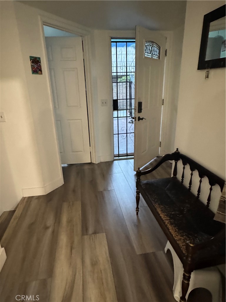 682 East Workman Street Covina, CA 91723 - Photo 14 of 34 a view of a hallway with wooden floor and stairs