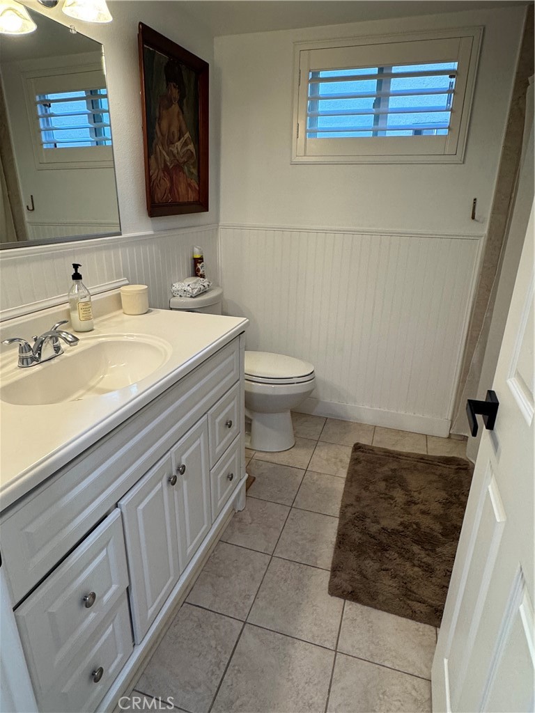 682 East Workman Street Covina, CA 91723 - Photo 21 of 36 a bathroom with a sink a toilet and mirror