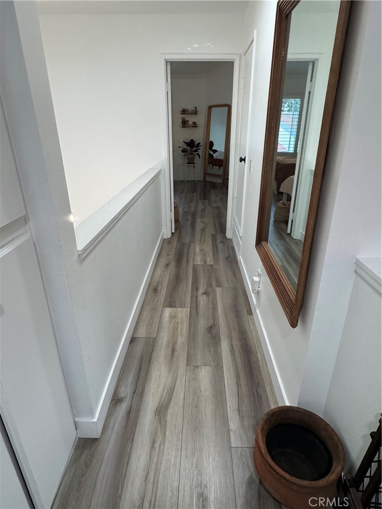 682 East Workman Street Covina, CA 91723 - Photo 23 of 34 a view of a hallway with wooden floor and staircase