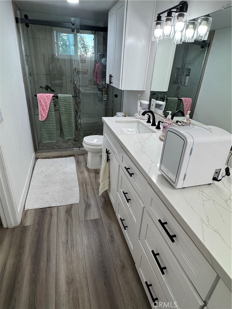 682 East Workman Street Covina, CA 91723 - Photo 27 of 34 a bathroom with a sink mirror and toilet