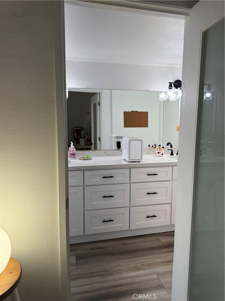 682 East Workman Street Covina, CA 91723 - Photo 31 of 36 a bathroom with a sink a toilet and a mirror