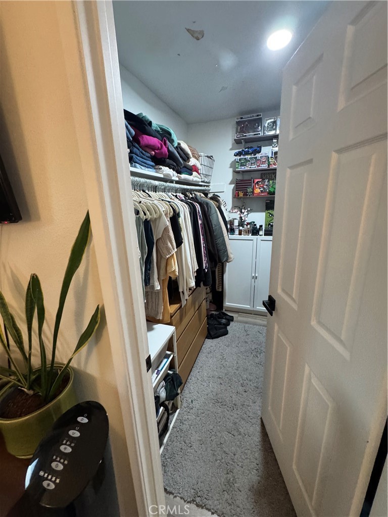 682 East Workman Street Covina, CA 91723 - Photo 32 of 34 a view of walk in closet with clothes and shoes