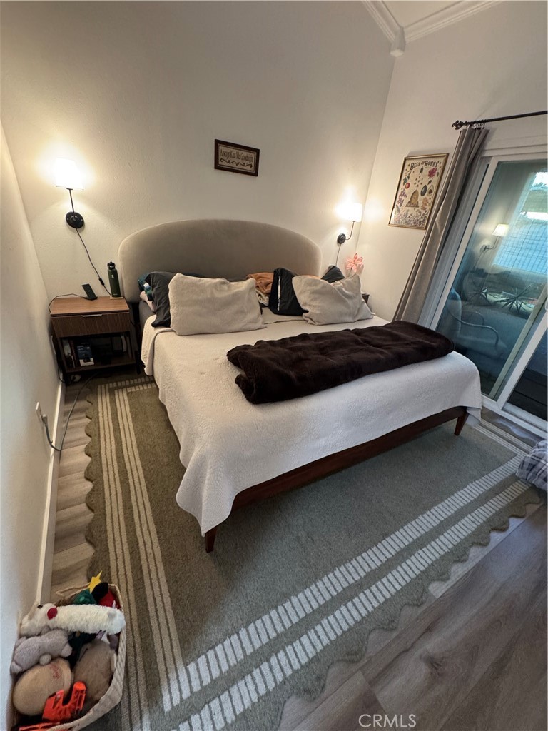 682 East Workman Street Covina, CA 91723 - Photo 33 of 36 a bedroom with a bed and a night stand