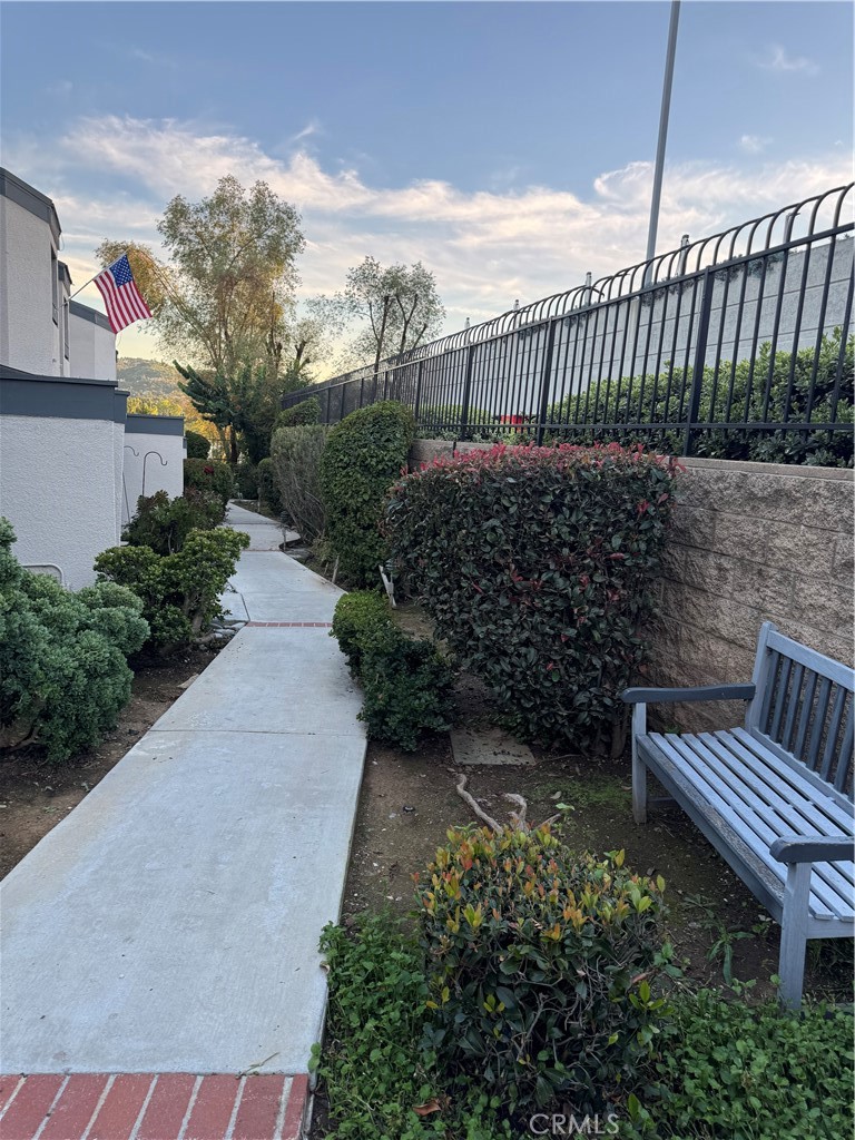 682 East Workman Street Covina, CA 91723 - Photo 4 of 34 a balcony with wooden fence and trees