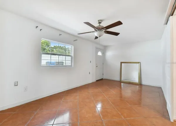 a view of an empty room with a window