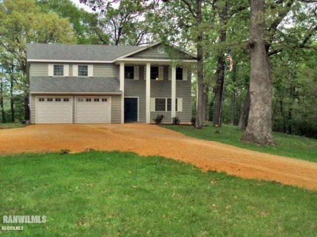 612 West Hanover Road Hanover, IL 61041 - Photo 1 of 1 a front view of a house with yard and green space