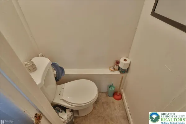 a bathroom with a toilet and a sink