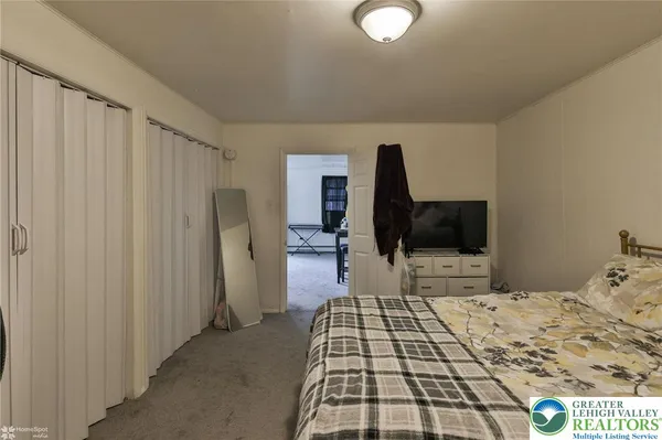 a bedroom with a bed and furniture