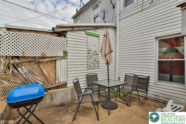 a view of a house with a fence