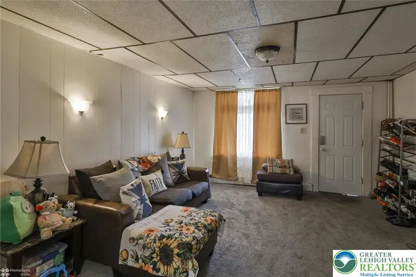 a living room with furniture and a window