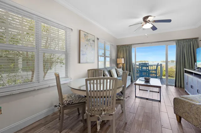 a view of a dining room with furniture window and outside view