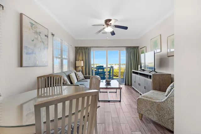 a living room with furniture fireplace and a window