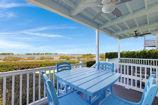 a view of a balcony with wooden floor