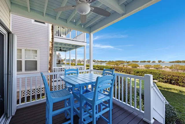 a view of a roof deck with table and chairs