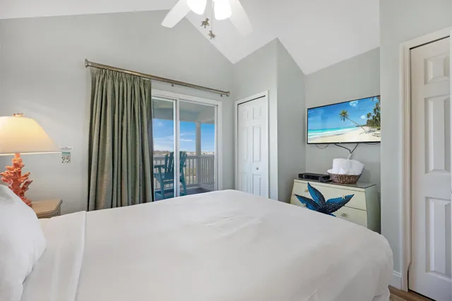 a bedroom with a bed and a lamp on table