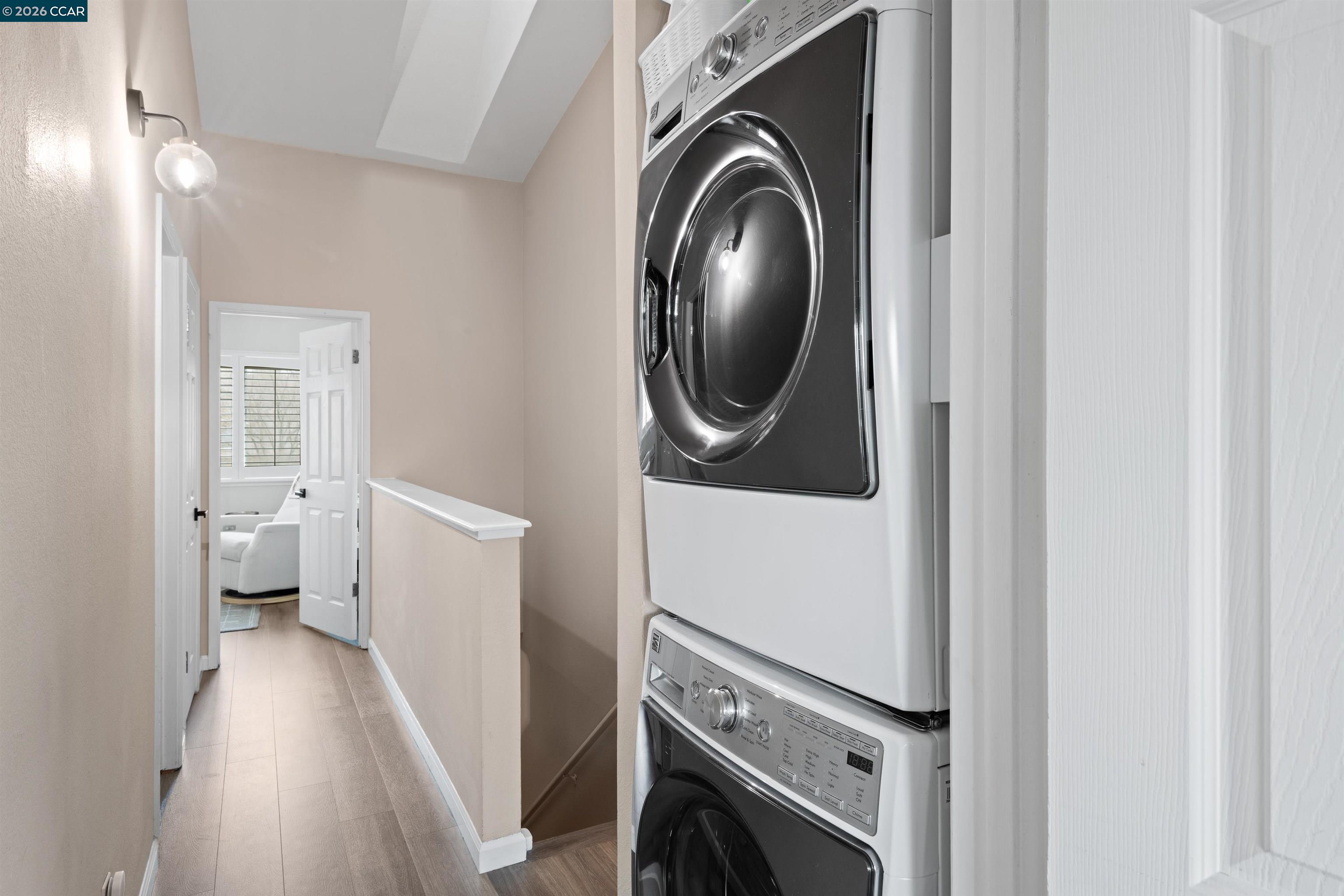 2721 Oak Road, Unit L Walnut Creek, CA 94597 - Photo 17 of 25 a view of a hallway with washer and dryer
