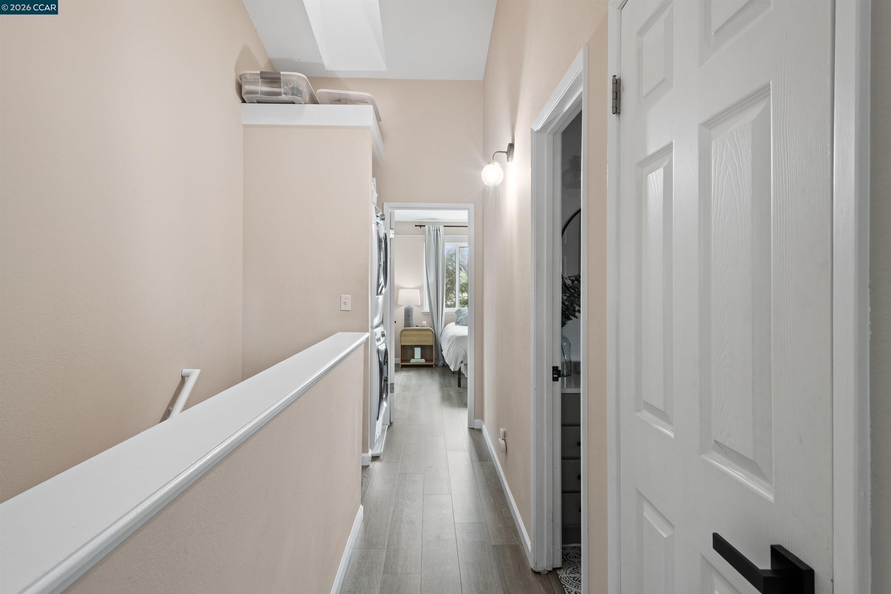 2721 Oak Road, Unit L Walnut Creek, CA 94597 - Photo 18 of 25 a view of a hallway with wooden floor and a bathroom