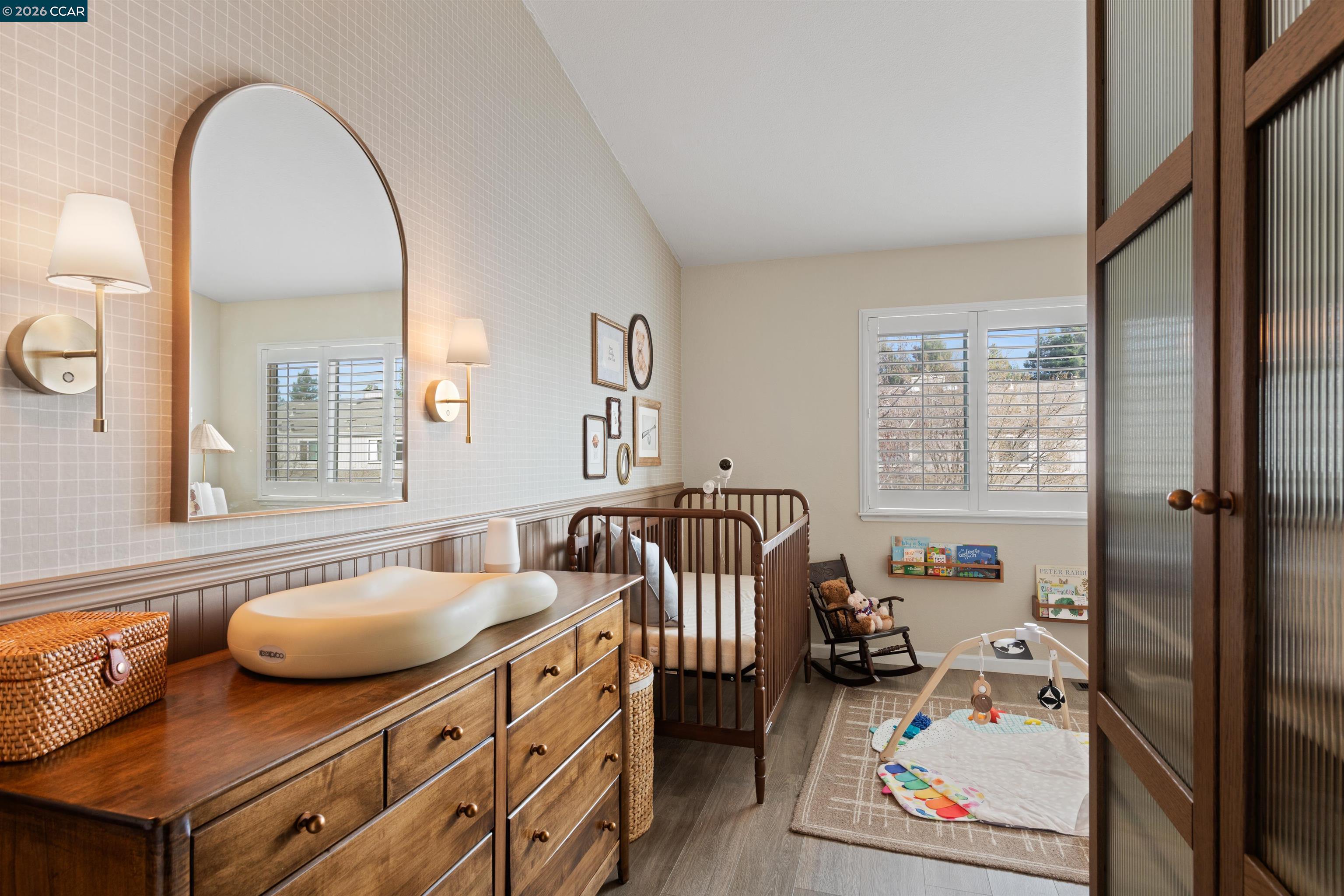 2721 Oak Road, Unit L Walnut Creek, CA 94597 - Photo 23 of 25 a bedroom with furniture and a wooden floor