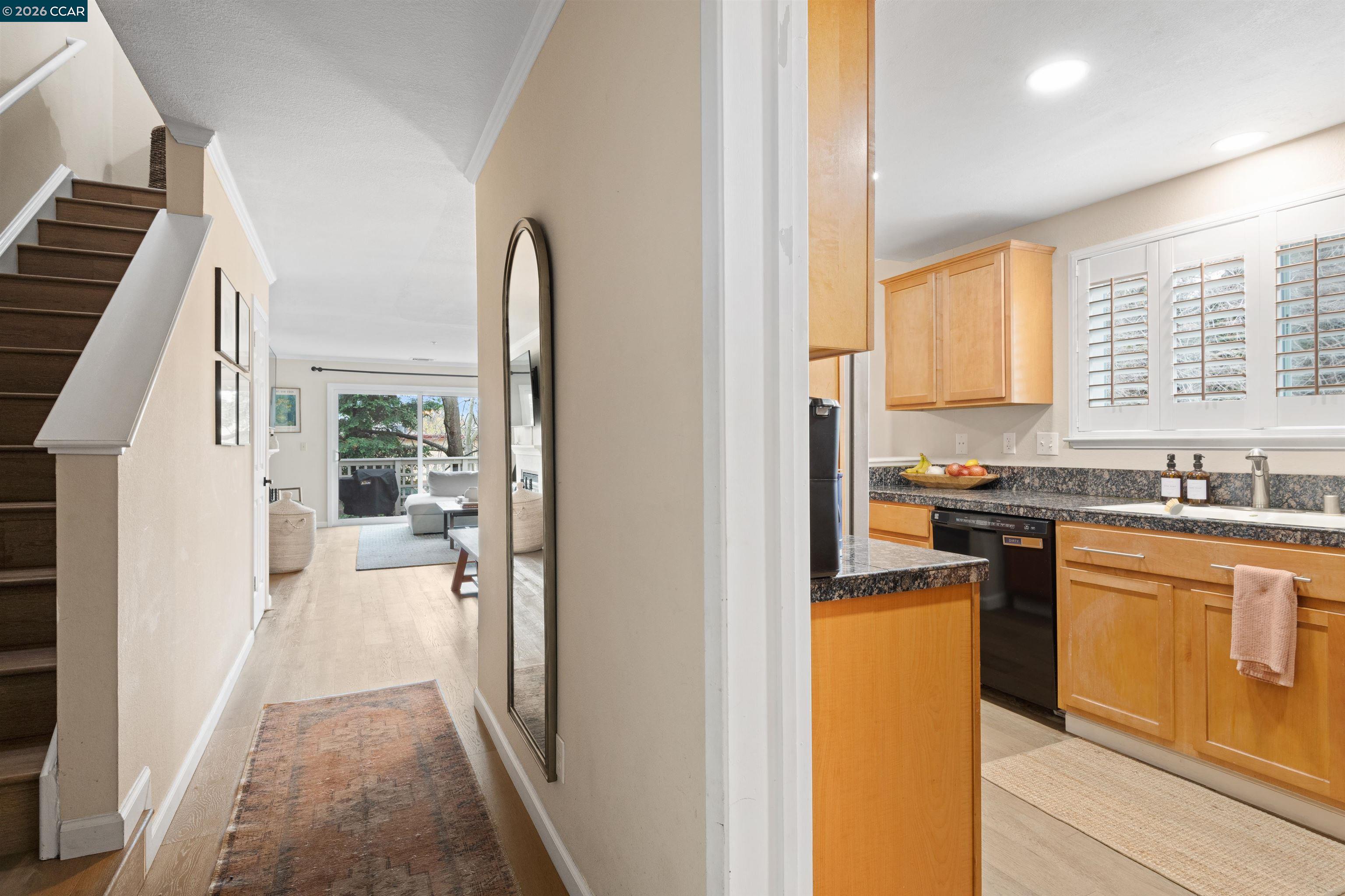 2721 Oak Road, Unit L Walnut Creek, CA 94597 - Photo 3 of 25 a kitchen with a refrigerator and a sink