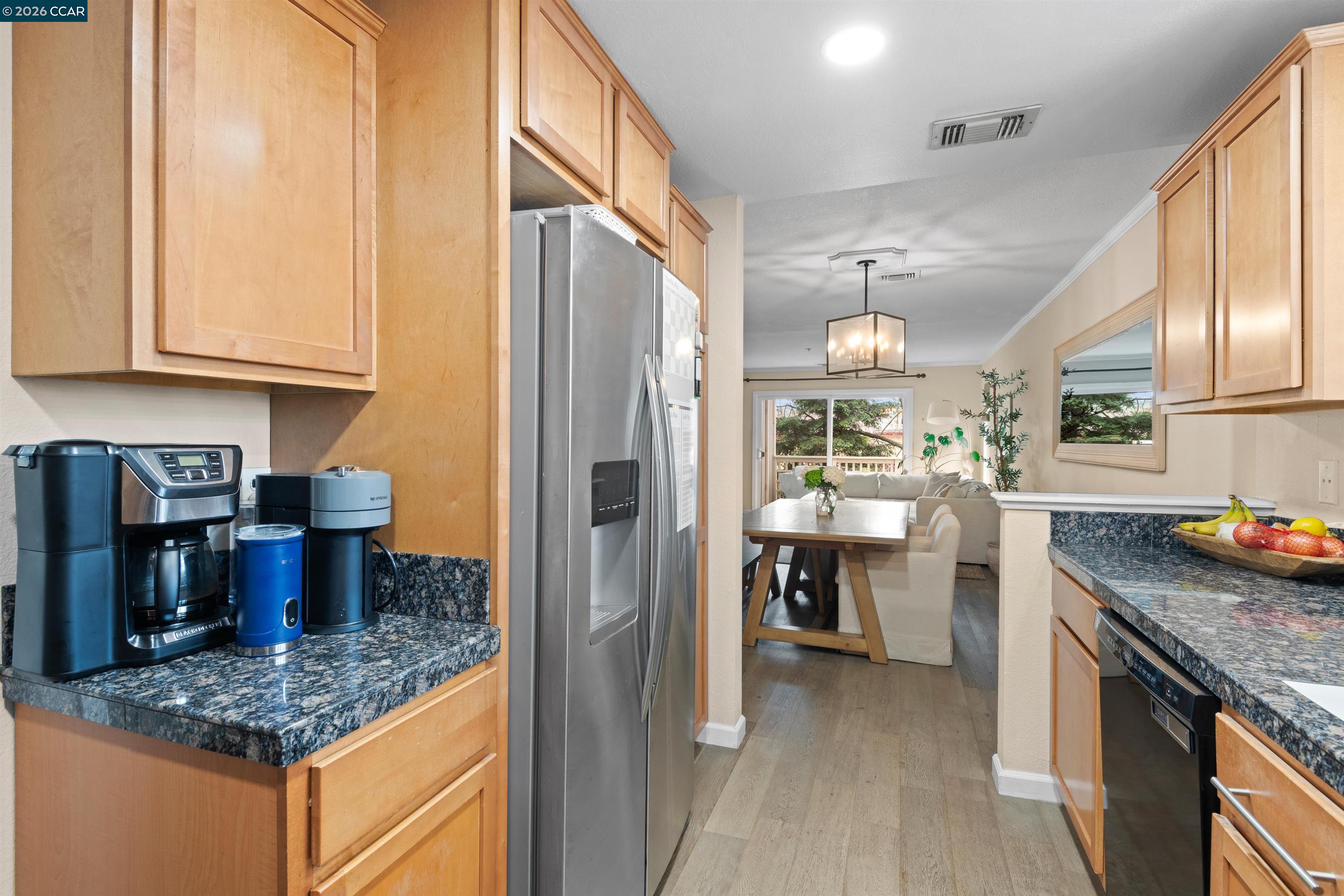 2721 Oak Road, Unit L Walnut Creek, CA 94597 - Photo 5 of 25 a kitchen with stainless steel appliances granite countertop a sink stove and refrigerator