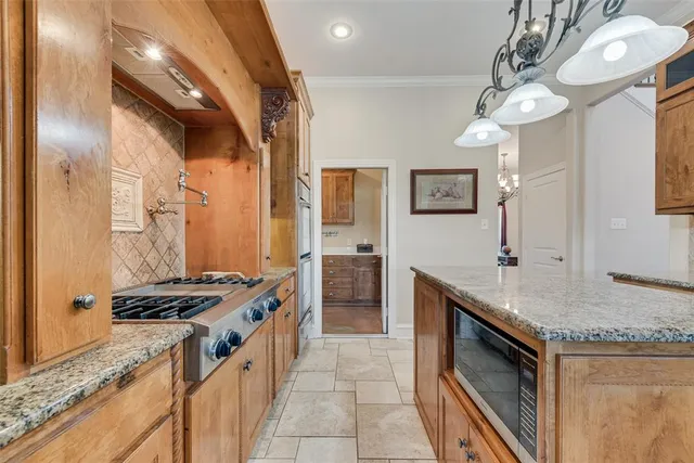 a view of a dining room with furniture wooden floor and chandelier