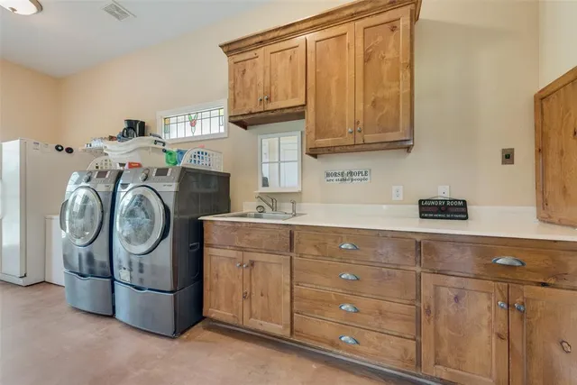 a dining room with furniture a chandelier and window