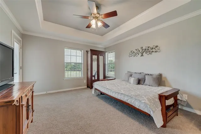 a en suite bathroom with a double vanity sink and a mirror