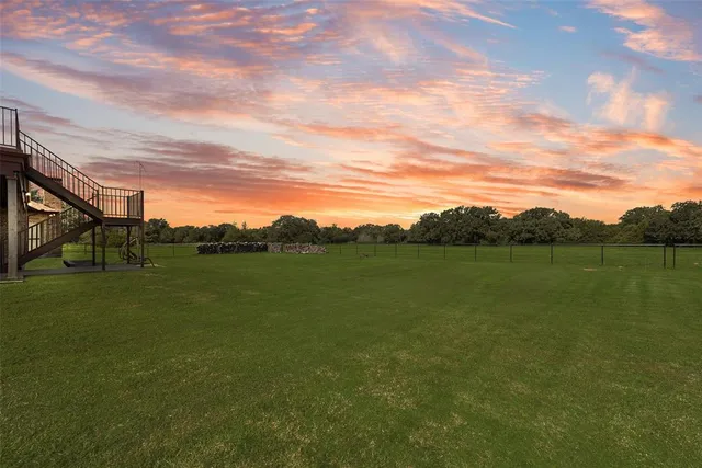 a view of a lake with a yard