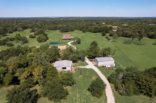 an aerial view of a golf course with chairs