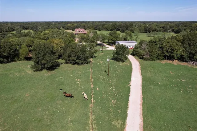 a view of a river and with trees in the background