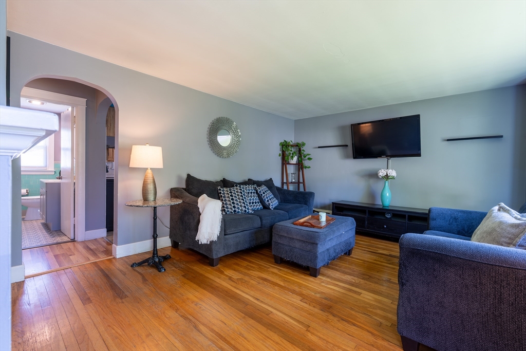 110 James M Beardsworth Road Tiverton, RI 02878 - Photo 3 of 26 a living room with furniture and a flat screen tv