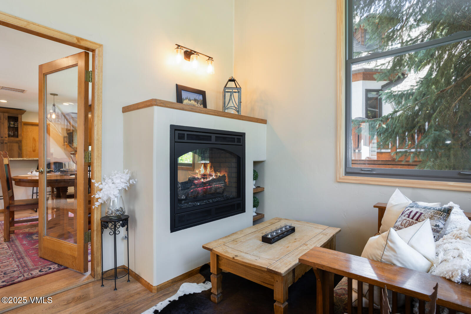 425 Deer Boulevard, Unit B Eagle-Vail, CO 81620 - Photo 11 of 26 a living room with furniture and a fireplace