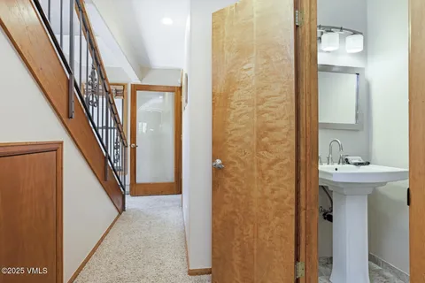 a view of a bathroom from the hallway
