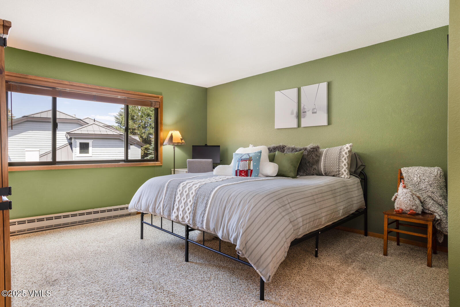 425 Deer Boulevard, Unit B Eagle-Vail, CO 81620 - Photo 14 of 26 a bedroom with a bed and a painting on the wall