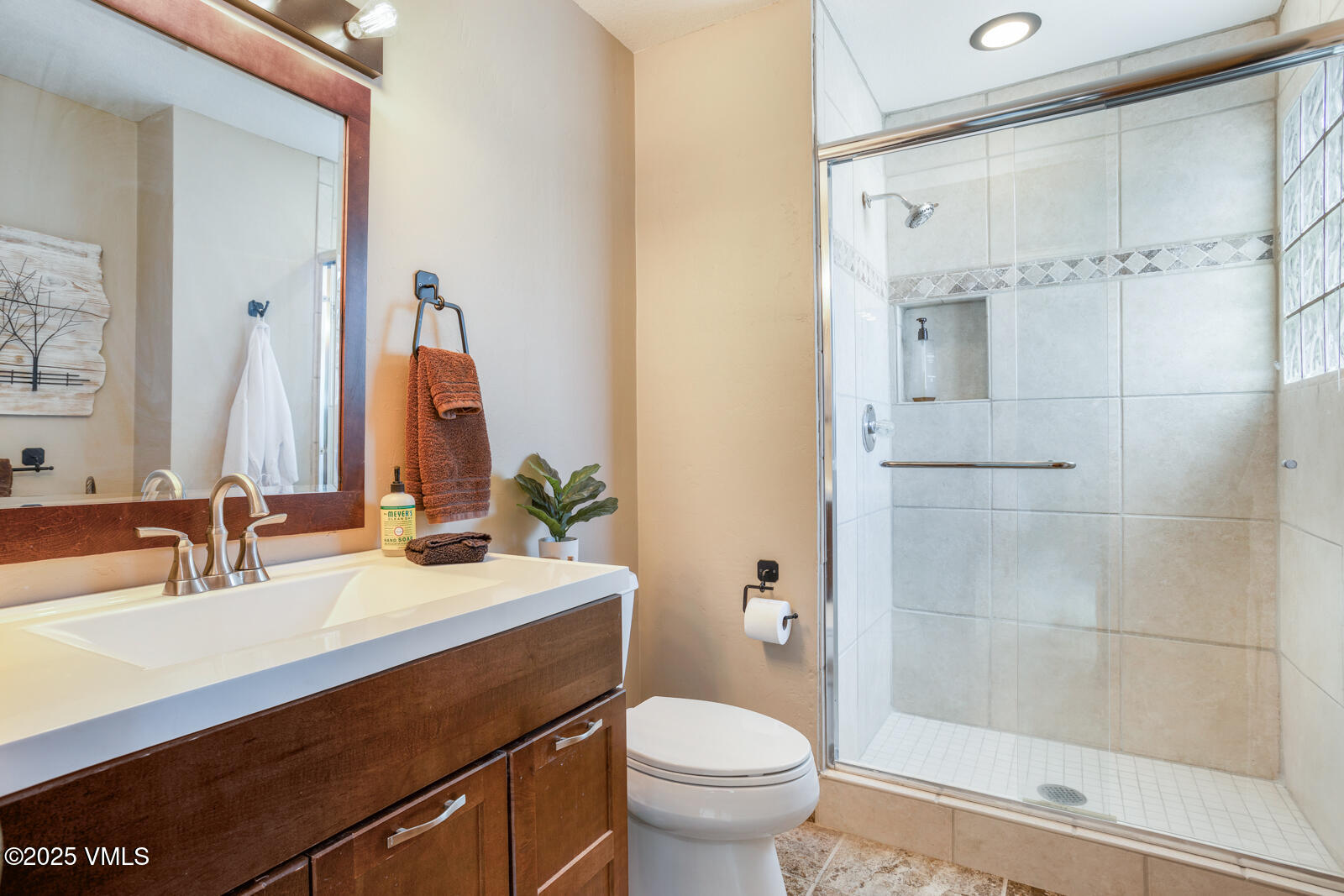 425 Deer Boulevard, Unit B Eagle-Vail, CO 81620 - Photo 16 of 26 a bathroom with a sink a toilet and shower